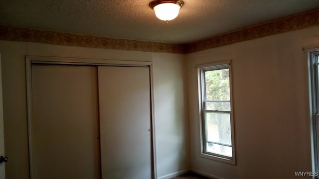 interior space with a textured ceiling