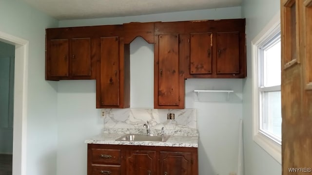 kitchen with backsplash and sink