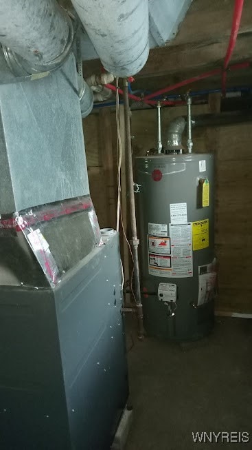 utility room featuring gas water heater