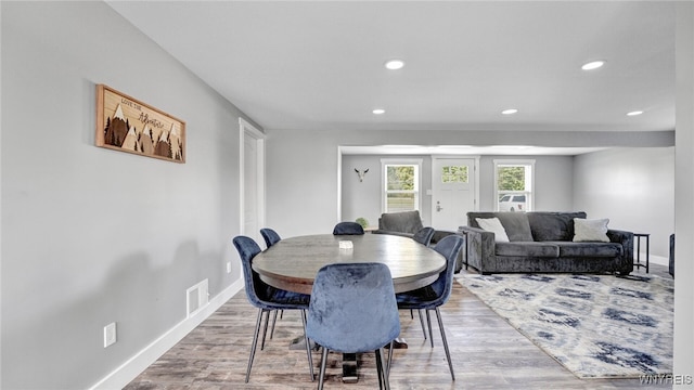 dining space with light hardwood / wood-style floors