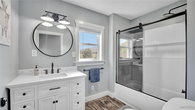 full bathroom with shower / bath combination with glass door, toilet, vanity, and hardwood / wood-style flooring