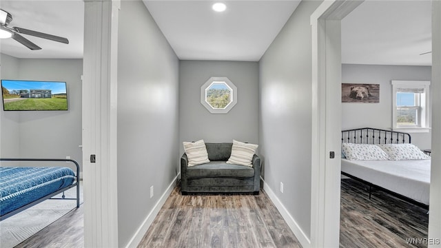 bedroom featuring hardwood / wood-style flooring and ceiling fan