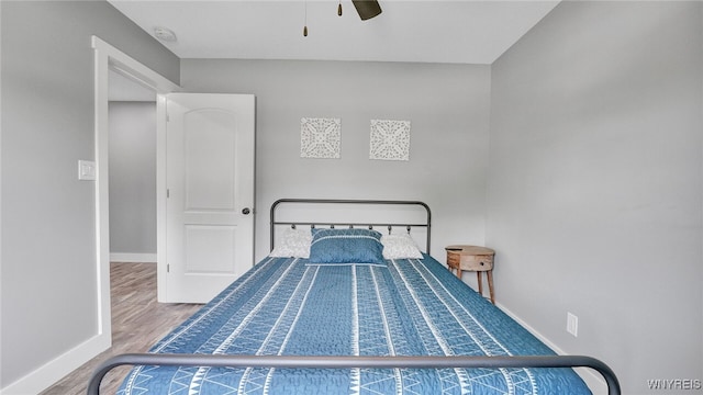 bedroom featuring ceiling fan and hardwood / wood-style floors