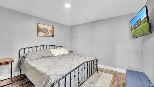 bedroom featuring wood-type flooring