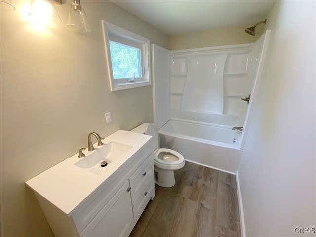 full bathroom featuring wood-type flooring, vanity, toilet, and shower / bathing tub combination