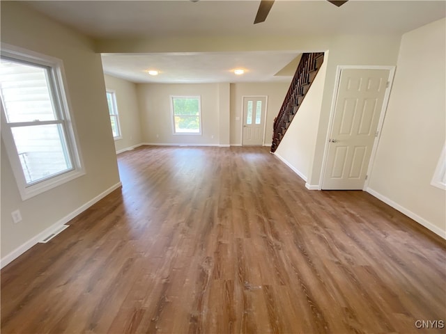 unfurnished room featuring ceiling fan and hardwood / wood-style flooring