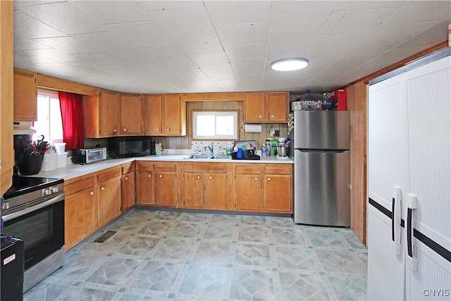 kitchen with appliances with stainless steel finishes and sink