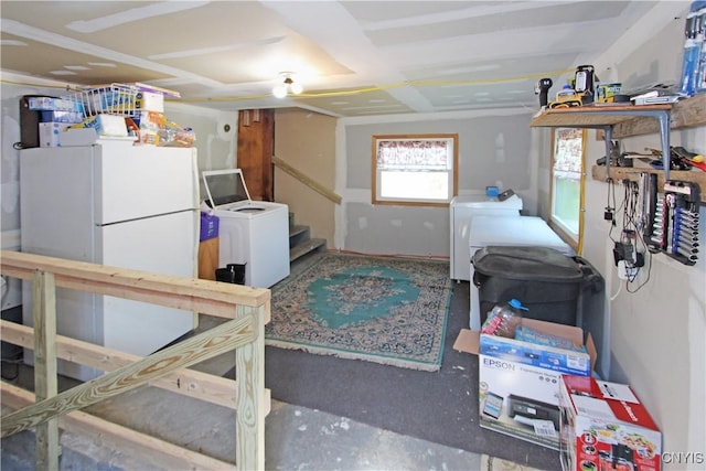 interior space with stairway and independent washer and dryer