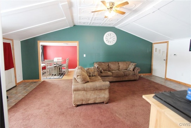 living room featuring lofted ceiling, ceiling fan, carpet, and baseboards