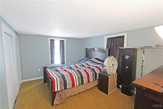 bedroom featuring baseboards and light colored carpet