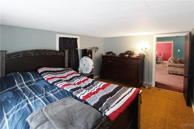 carpeted bedroom with baseboards