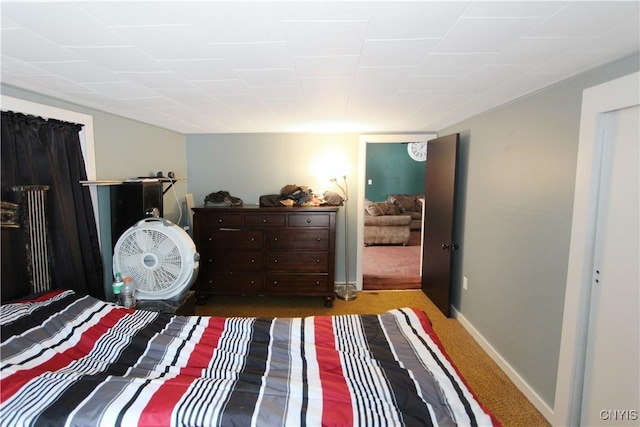 bedroom with baseboards and carpet flooring