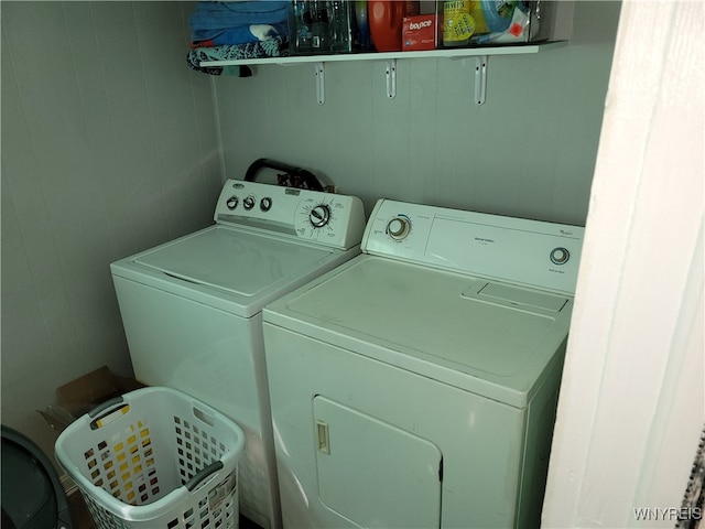 clothes washing area featuring washer and clothes dryer