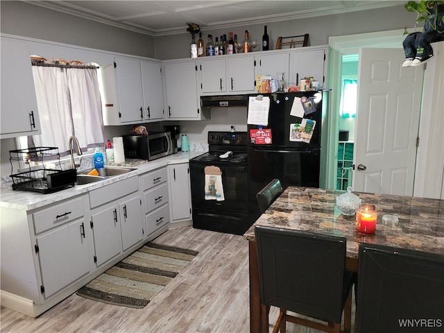 kitchen with black appliances, light hardwood / wood-style floors, white cabinetry, and crown molding