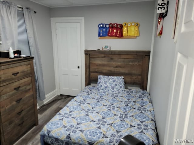 bedroom with hardwood / wood-style floors