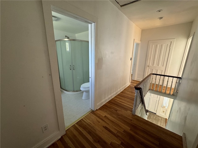 hall with dark hardwood / wood-style flooring