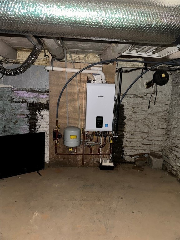 utility room featuring tankless water heater