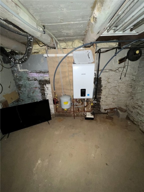 basement featuring tankless water heater