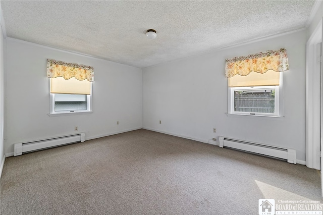 unfurnished room with a textured ceiling, crown molding, carpet floors, and a baseboard radiator