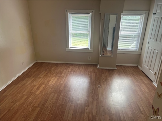 spare room featuring hardwood / wood-style floors