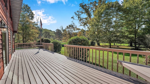 wooden terrace with a yard