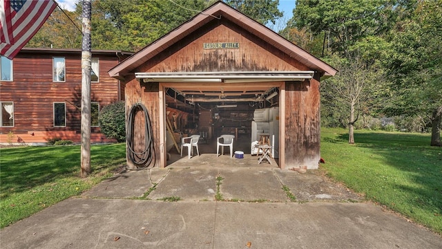 view of outdoor structure featuring a lawn