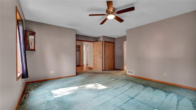 unfurnished bedroom with carpet and ceiling fan