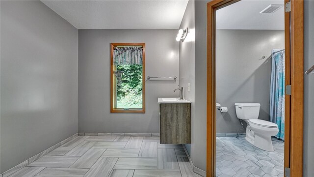 bathroom with vanity and toilet