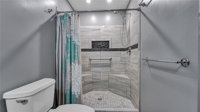 bathroom featuring walk in shower and toilet