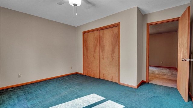 unfurnished bedroom featuring ceiling fan, a closet, and carpet flooring