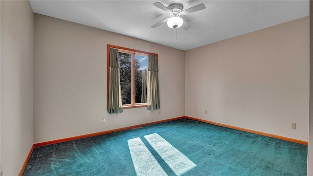 spare room with carpet and ceiling fan