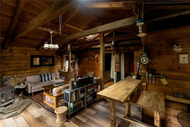 living room with wooden ceiling, vaulted ceiling with beams, wooden walls, and hardwood / wood-style flooring