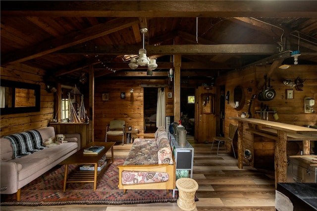 living room featuring wooden walls, vaulted ceiling with beams, hardwood / wood-style flooring, and wooden ceiling