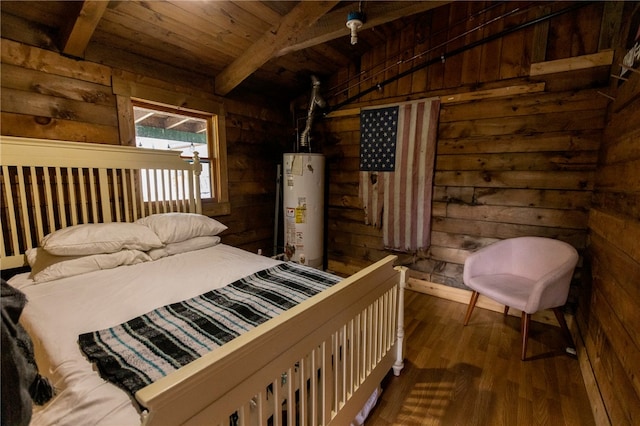 bedroom featuring beam ceiling, rustic walls, wooden ceiling, gas water heater, and hardwood / wood-style floors