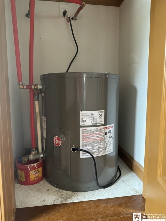 utility room featuring water heater