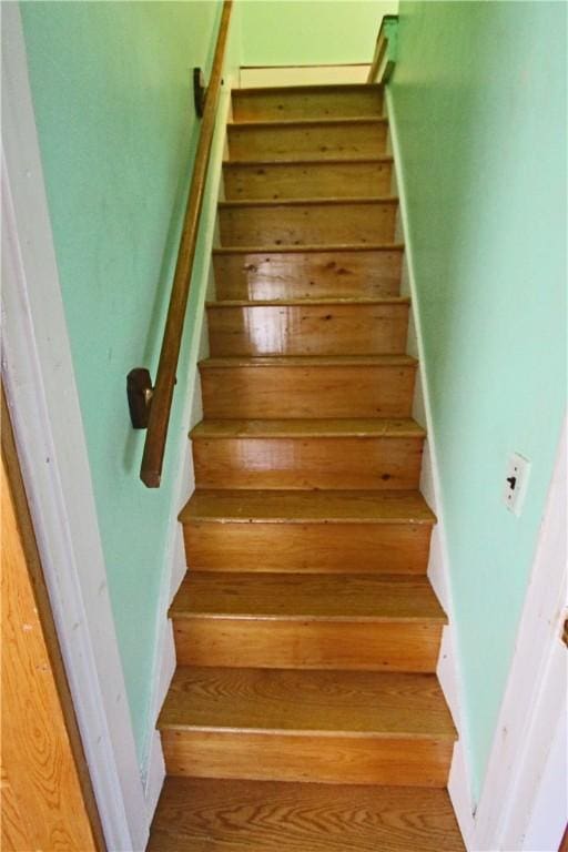 stairway with wood finished floors