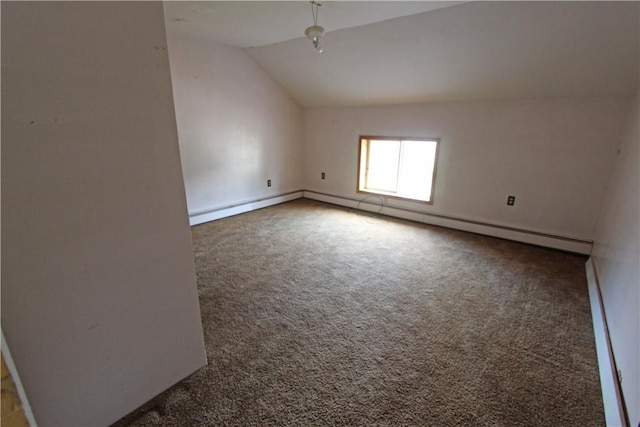 empty room with a baseboard radiator, lofted ceiling, and carpet floors