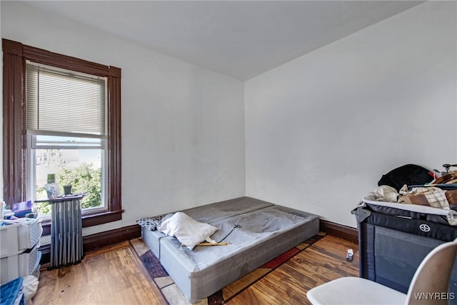 bedroom featuring dark hardwood / wood-style flooring