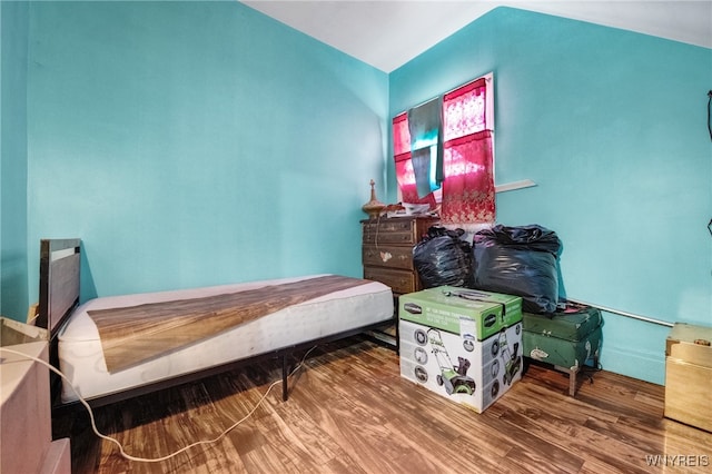 bedroom with wood-type flooring