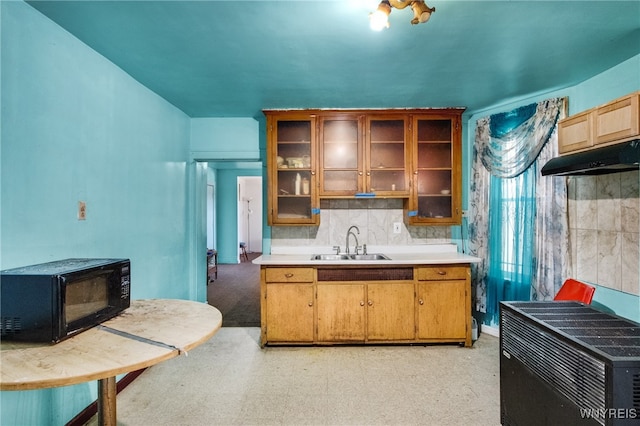 kitchen with sink and decorative backsplash