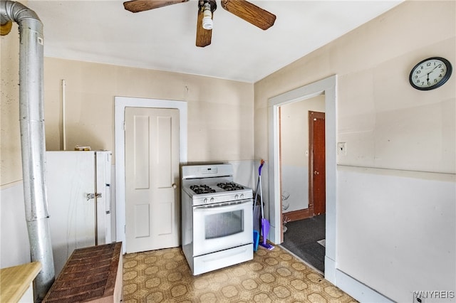 kitchen featuring white appliances and ceiling fan