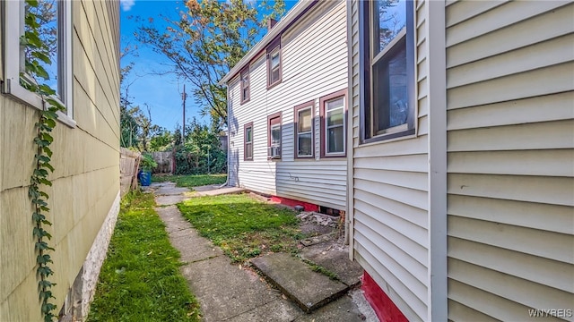 view of side of home featuring cooling unit