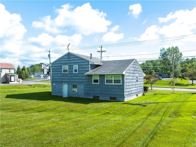 back of property with a yard