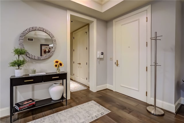 entryway with dark hardwood / wood-style floors