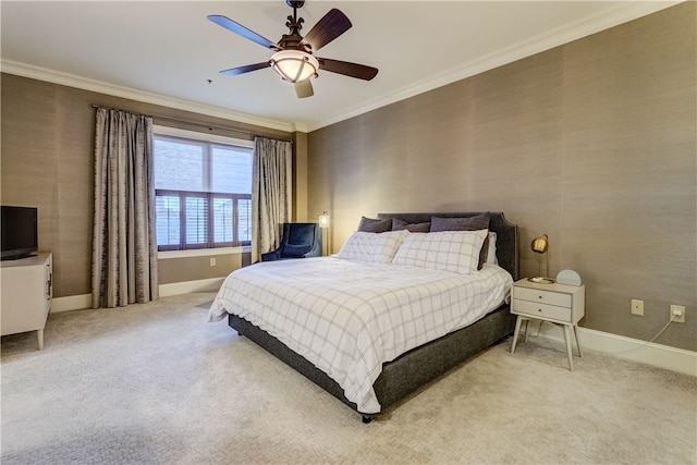 carpeted bedroom with ceiling fan and crown molding