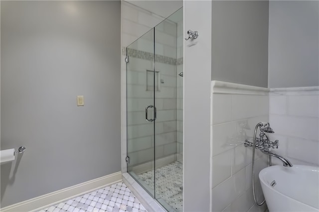 bathroom with tile patterned flooring and separate shower and tub