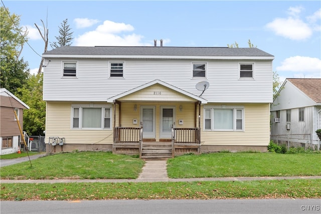 view of front facade featuring a front yard and a porch