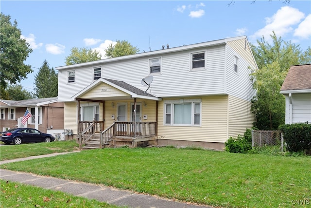 view of front of home featuring a front lawn and covered porch