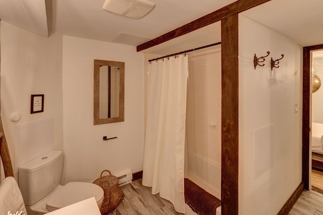 bathroom with shower / bath combination with curtain, hardwood / wood-style flooring, baseboard heating, and toilet