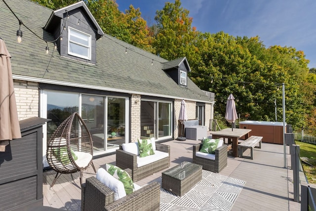 exterior space with an outdoor hangout area, a wooden deck, and a hot tub